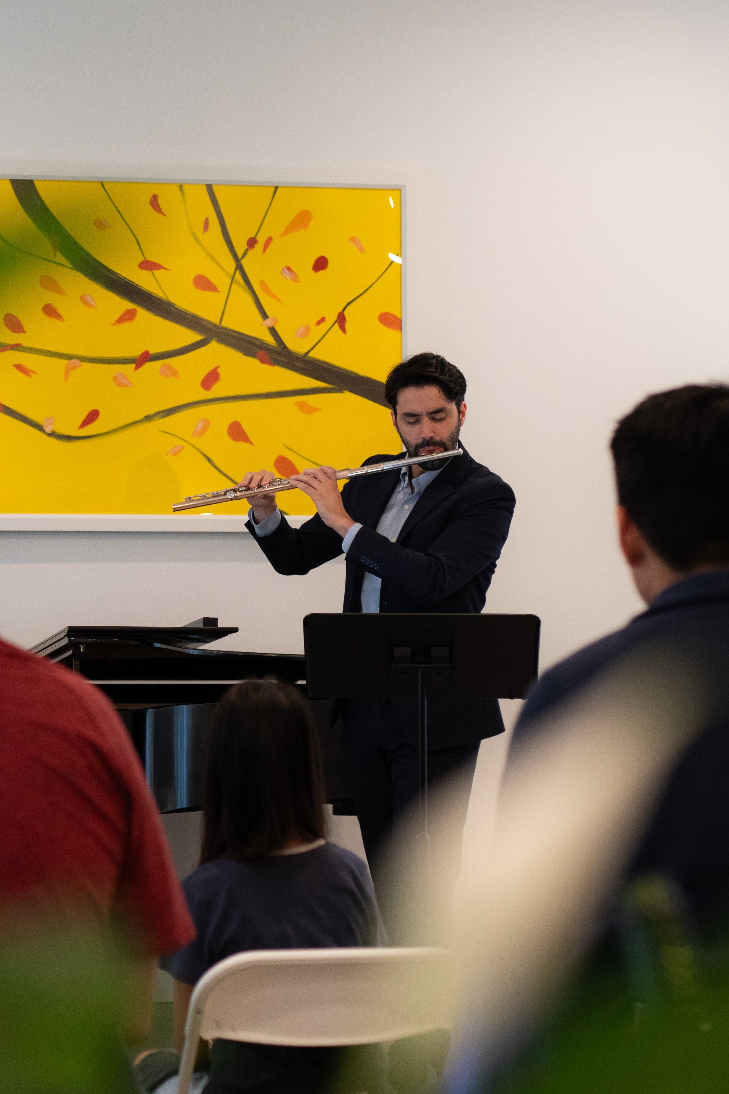 mima founders in front of piano